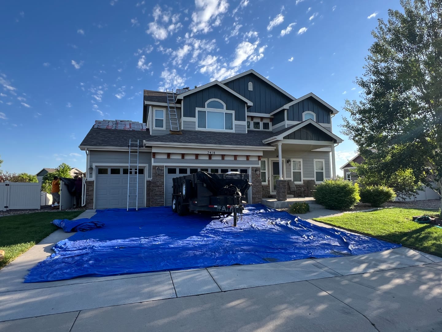 Two-story home shingles loaded ready for installation